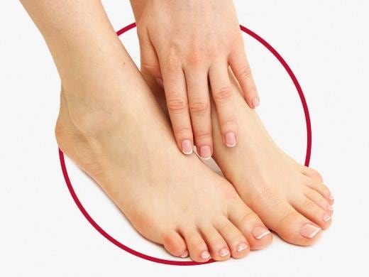 Closeup view of woman’s feet with beautiful healthy nails after Canesten fungal nail treatment